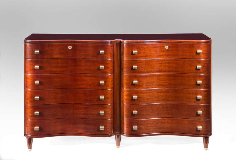 Great provenance, a special commission by Borsani's own lawyer. This outstanding double commode has a sensuous serpentine front and beautifully colored mahogany. The double bow front top with the original inset reverse painted glass, above two sets