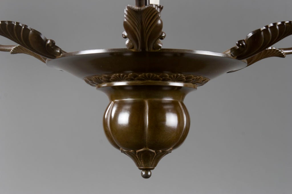 A Patinated Metal Chandelier Attributed to Just Andersen 1