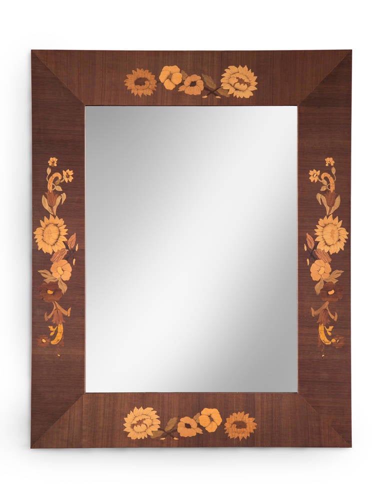 A joyful and skilled example of Swedish marquetry at its best. The rectangular mirror plate within a wooden frame adorned by four floral garlands centring each side.