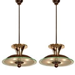 Pair of Patinated Bronze, Brass, and Chiseled Glass Chandeliers