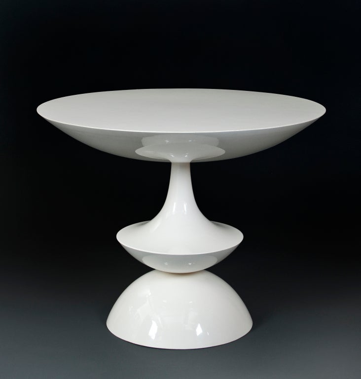 The circular top, above a shaped monopodium, terminating in a circular base. By Domus Danica. 

Nanna Ditzel (Danish 1923 - 2005) was a multitalented designer whose successful career spanned longer that any other designer of the Danish Modern