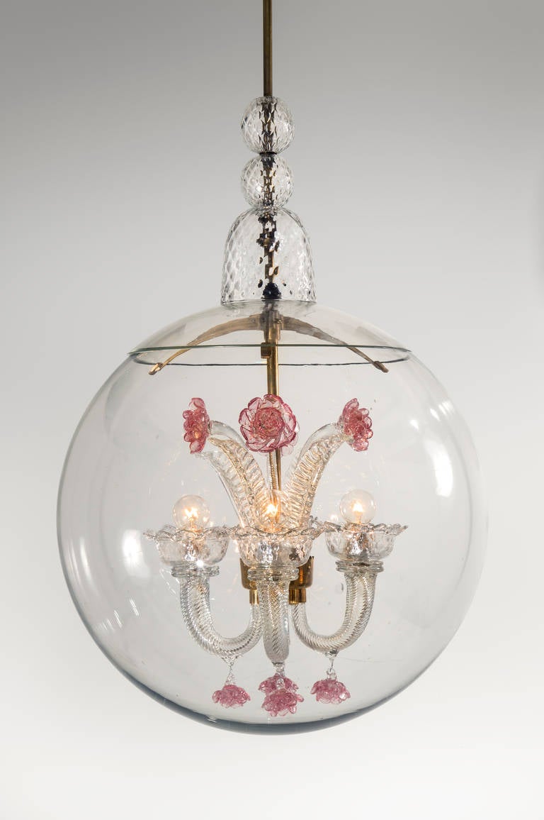 The gilt glass canopy above a brass stem embellished with three faceted glass elements, the 4 lights raised on curved arms and adorned by colorless leaves and colored flowers, enclosed by a large sphere.

Numerous related 