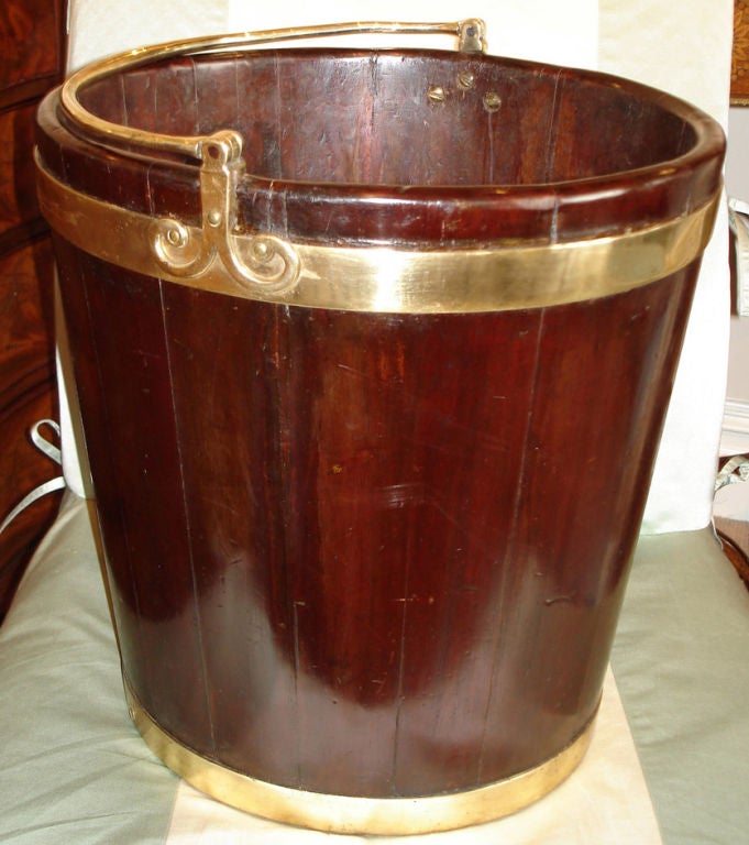 A beautiful mahogany peat bucket