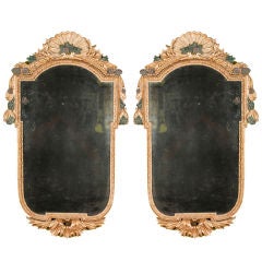 A carved pair of polychromed and gilded Italian girandoles