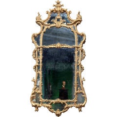 A Magnificent and Exquisitely Carved Giltwood Mirror