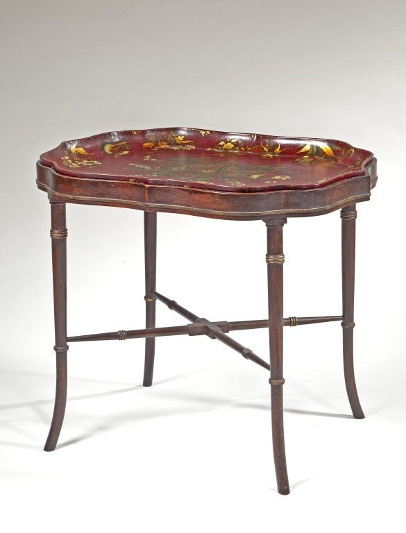 A rare and unusual japanned chinoiserie papier mache tray table by Henry Clay.  Base is 20th century.  Bottom of the tray is impressed with the mark: ‘CLAY, KING ST, COVTGARDEN

Henry Clay took out a patent on ‘new and improved Paper-ware’ in