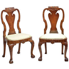 A pair of George II carved walnut side chairs in the manner of Giles Grendey