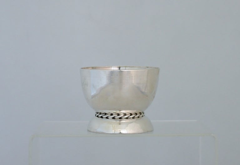 Being offered is a circa 1940 set of six (6) handwrought sterling silver dessert cups designed by William Spratling of Taxco, Mexico, each cup with superb hand hammering marks, the base and body separated by Spratling's distinctive rope motif. 