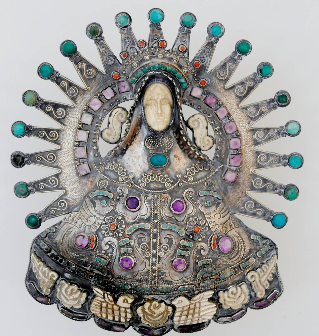 Being offered is a circa 1940 sterling silver centerpiece by Matilde Poulat (Matl), of Taxco, Mexico. Religious footed centerpiece with elaborate embossing and native stones applied throughout. Poulat, who attended art school with Diego Rivera, was