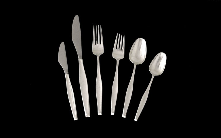 Being offered is a large circa 1961, 149 piece sterling silver flatware set by Gorham of Providence, Rhode Island, in the much sought after Classique pattern designed by Burr Sebring who became Gorham's chief designer during the 1970s; consisting of