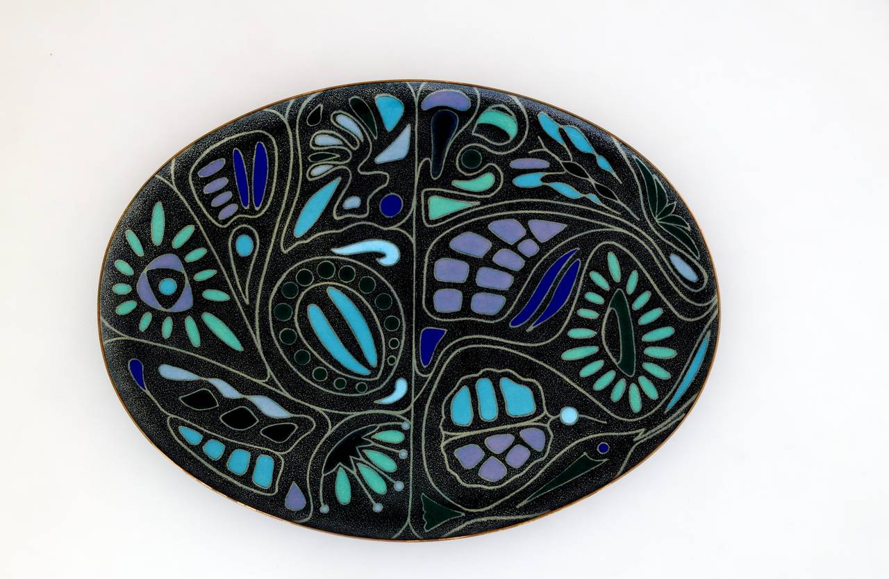 Being offered is a museum quality dish by Miguel Pineda of Taxco, Mexico. Copper formed dish with typical enameled motifs rich in multi colors. Dimensions:8 inches wide by 11 1/2 inches long by 1/2 inch high.  Marked as illustrated. In excellent