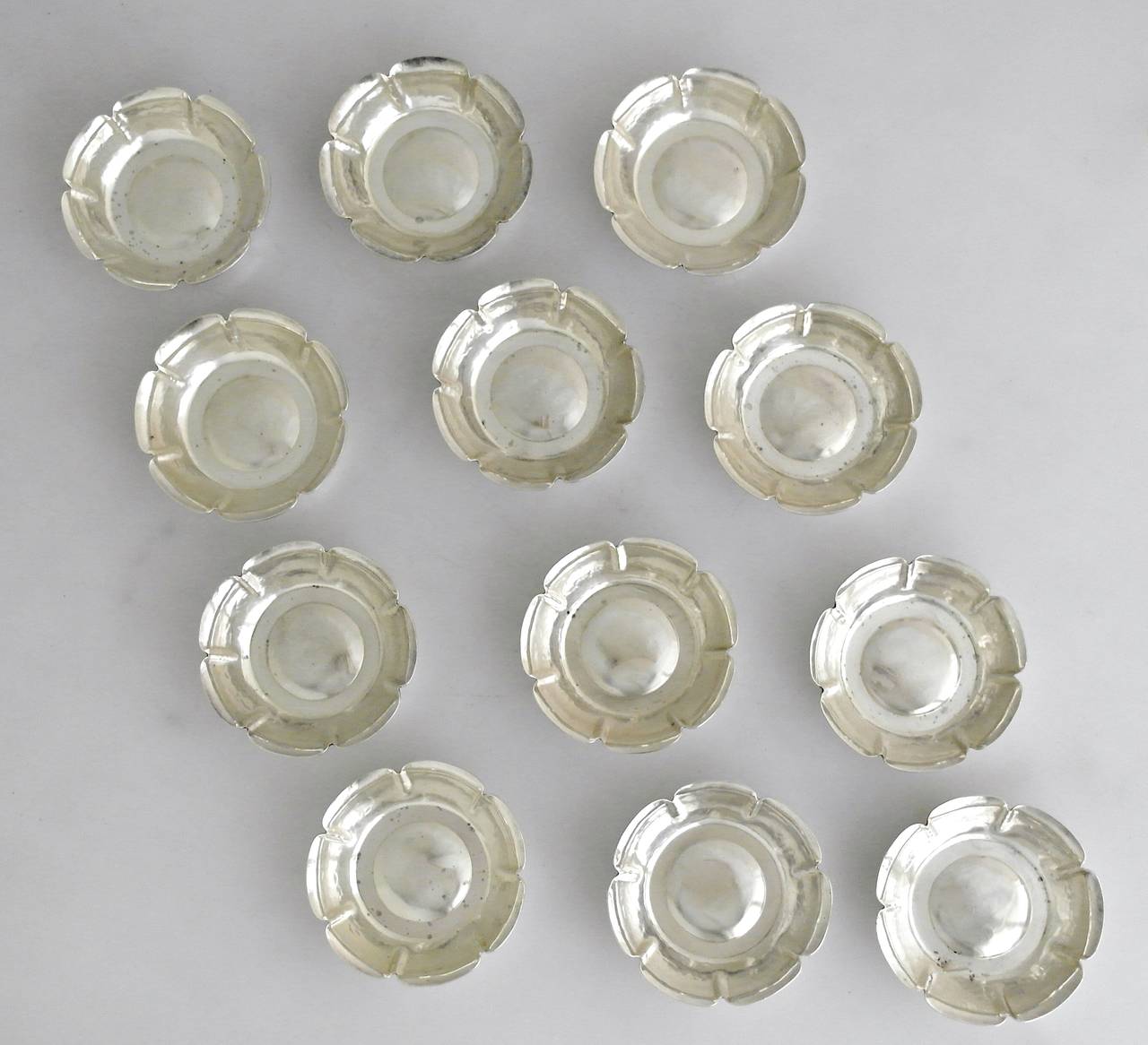 Joel Hewes Handmade Arts & Crafts Sterling Silver Set of 12 Nut Dishes In Excellent Condition In New York, NY