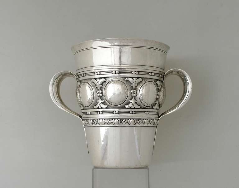 Being offered is a circa 1911 sterling silver champagne & wine bucketcooler by Tiffany & Co. of New York City, two-handled piece with intricately detailed floral & circular motifs hand chased; and elegant incised lines on the handles, all on a