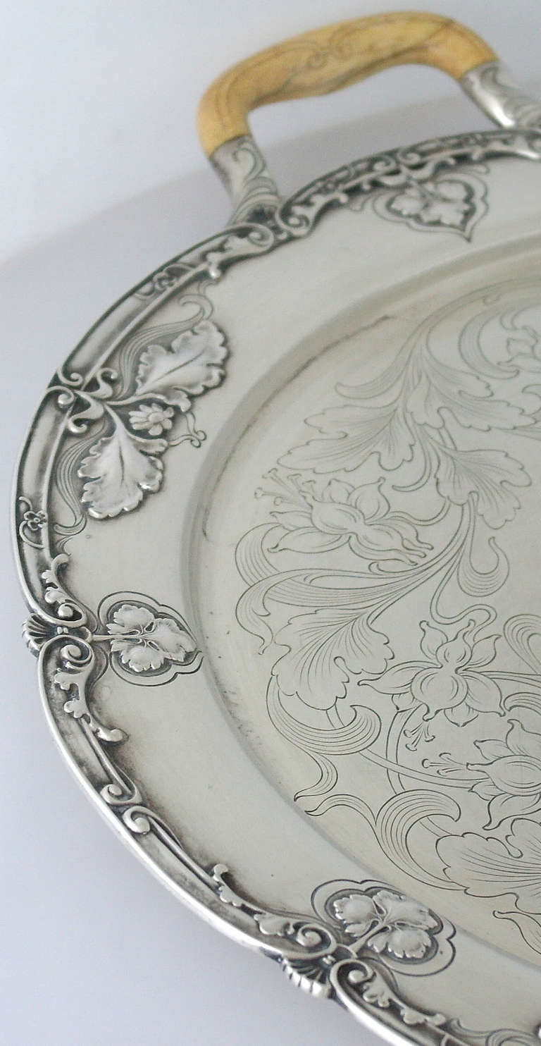Being offered is a fine circa 1900 sterling silver tray with handles appropriate for period by Gorham, of Providence, RI, in the Athenic pattern which illustrates Gorham's prowess in producing Art Nouveau silver.  The tray is masterfully engraved in