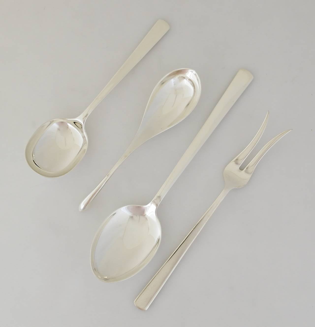 Being offered is a sterling silver flatware set by Codan of Mexico. Codan is known for their Danish modernist designs. This incredible 52 piece set consists of the following:
Eight teaspoons (5 3/4