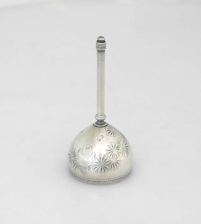Being offered is a circa 1882 sterling silver bell by Gorham of Providence, Rhode Island. In the aesthetic taste with floral & bird etched motifs on the bell. Dimensions: 3 1/2
