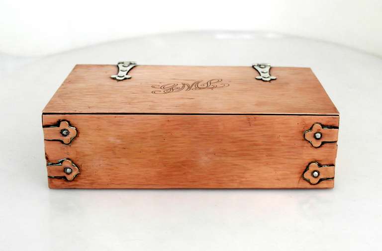 Being offered is a circa 1910 sterling silver & copper box by Thomas G. Brown & Sons of New York, New York. Entirely hand made box with hand hammered texture, sterling silver and copper rivets; brass interior. Dimensions: 9" x 5
