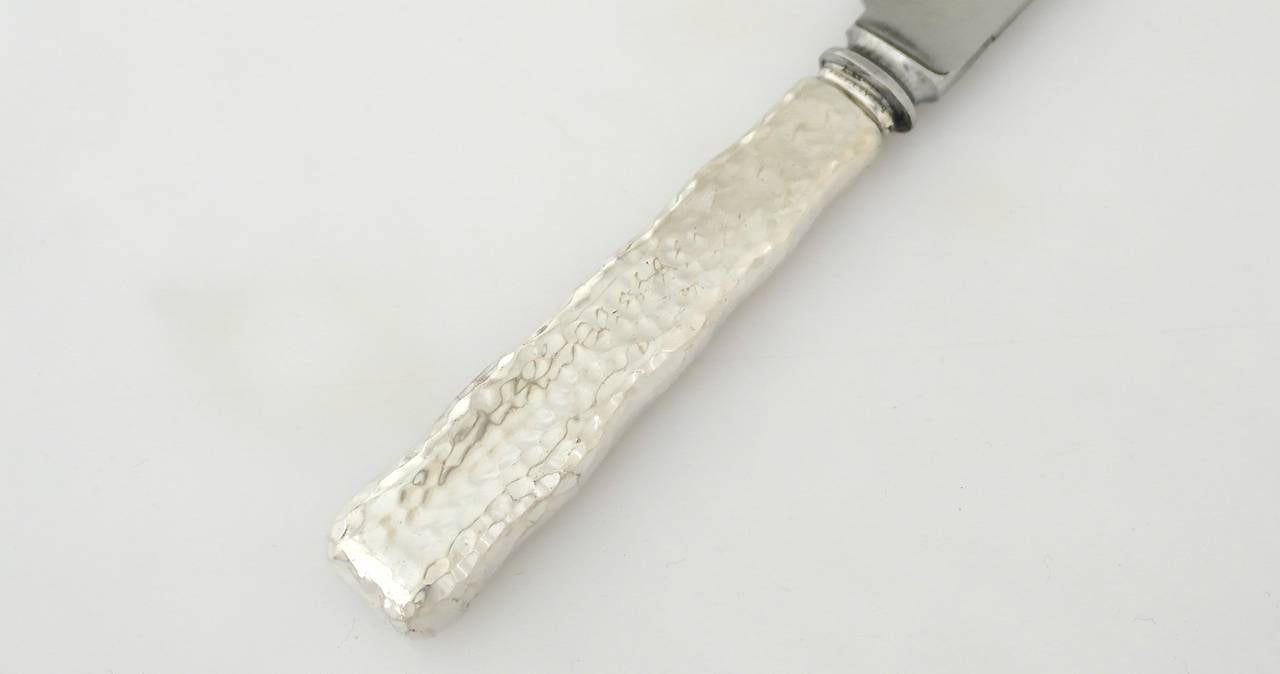 Late 19th Century Tiffany Sterling Silver Lap Over Edge Set of Eight Hammered Dinner Knives
