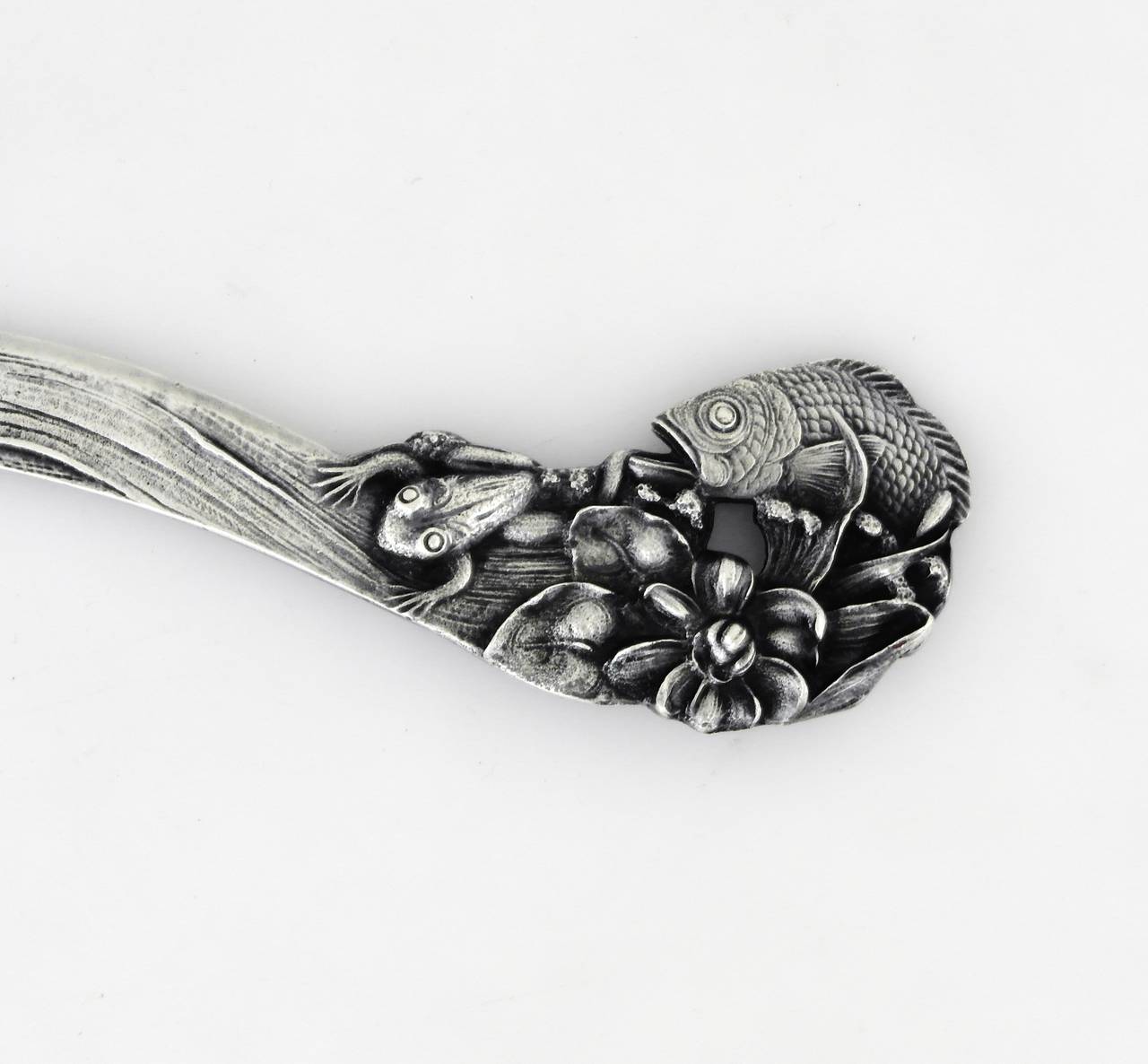 Being offered is an impressive sterling silver letter opener by Mauser Manufacturing Co. of New York. Object decorated entirely on both sides with fish, frogs, lily pads, reeds and flowers. Impressive detail. Dimensions: Weight shy of 3 oz. Marked