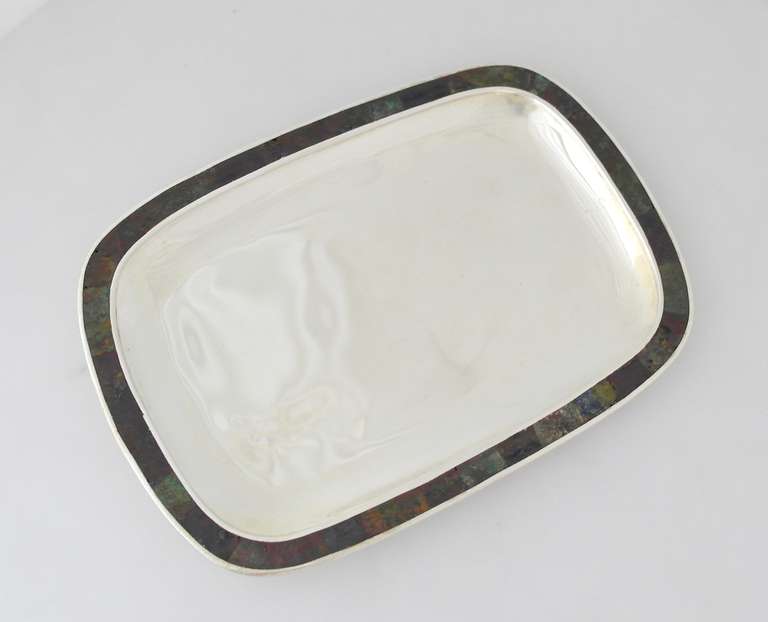 Being offered is a contemporary silverplate tray by Los Castillo of Taxco, Mexico. Entirely handmade piece, rectangular shape with bordered multi-stone inlay. Dimensions: 11