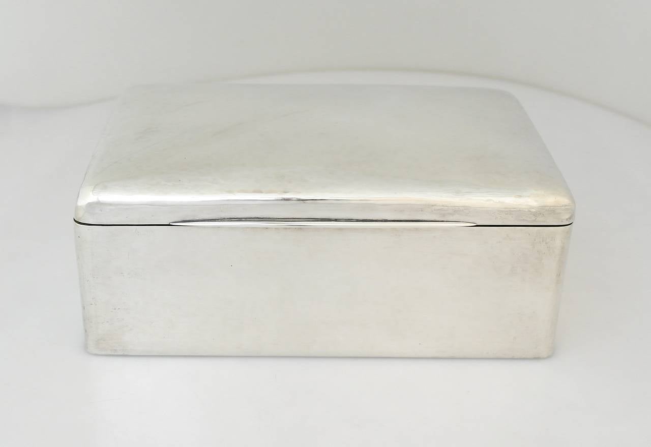 Being offered is a circa 1915 sterling silver box by Richard Dimes of South Boston, Massachusetts. Large hand-wrought box; heavy gauge silver with allover hammered texture. An excellent example of Arts & Crafts work seldom found in this size.