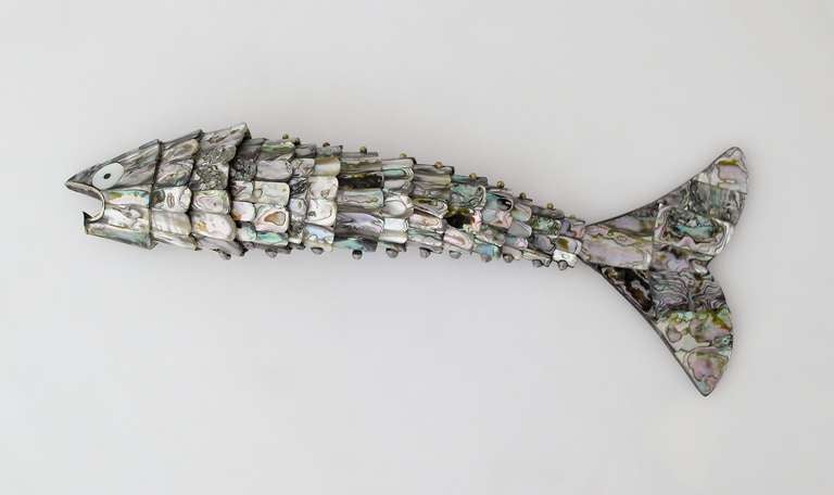 Being offered is a vintage articulate abalone fish bottle opener from Mexico, the figural and life-like fish with abalone scales.  The opener can also be positioned to sit on its tail. Dimensions of this opener 8 inches. Excellent condition.
