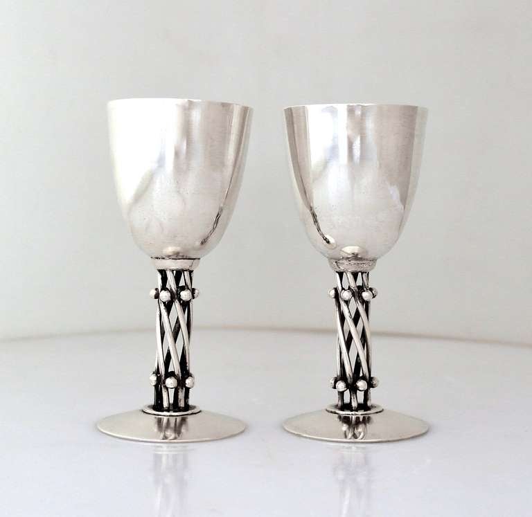 Being offered is a set of six (6,) circa 1964 sterling silver goblets by William Spratling of Taxco, Mexico; entirely handmade cocktail goblets with ball studded spiral stems as the primary decorative element. This design was one of a few pieces