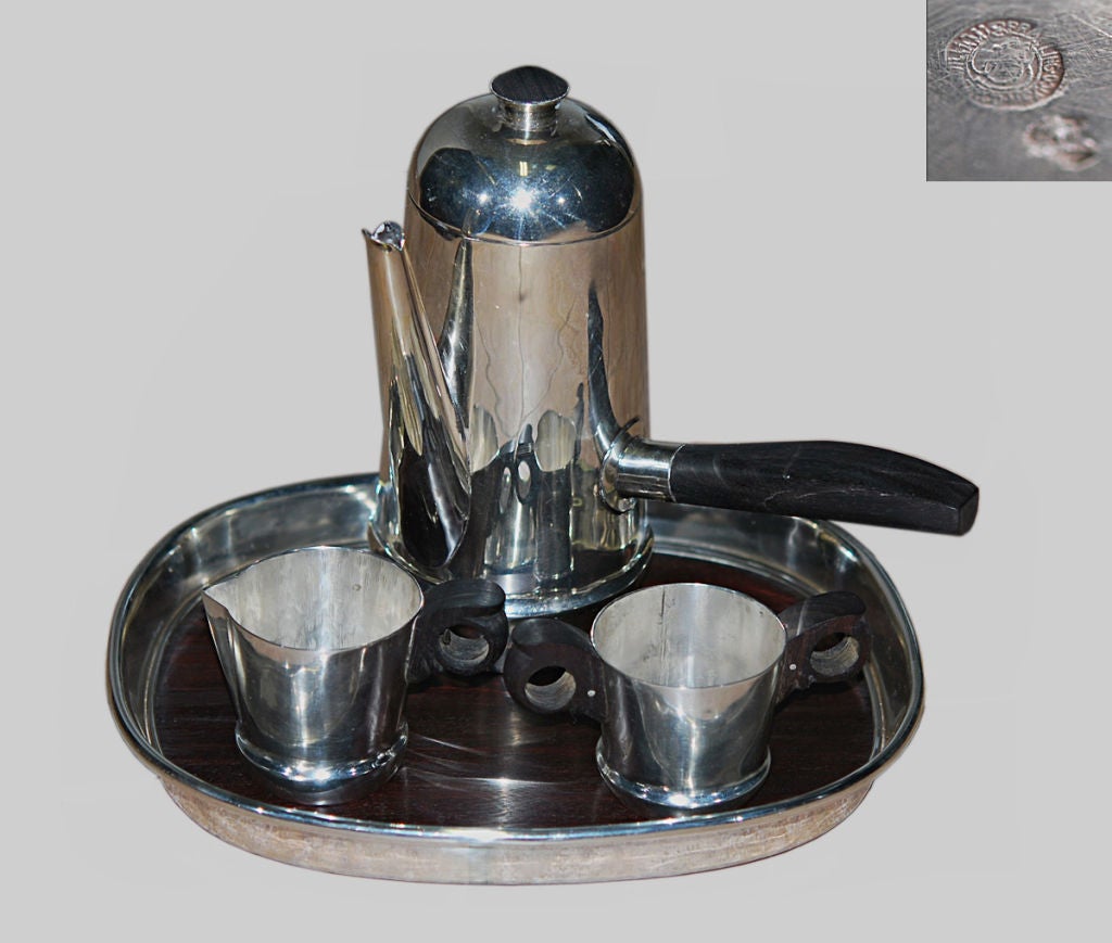 Being offered is a rare circa 1950 sterling silver coffee - espresso set by William Spratling of Taxco, comprising espresso - coffee pot, creamer and sugar and rare ebony and sterling silver tray. The pot has ebony handle and finial, the creamer and