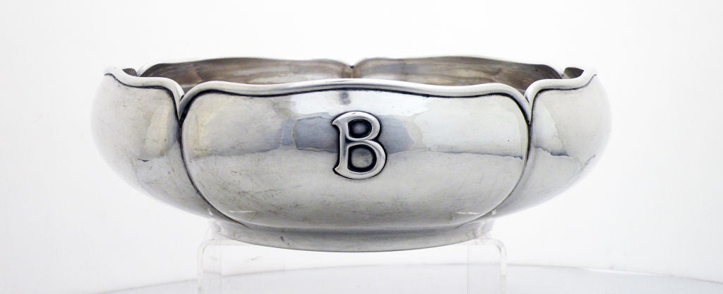 Being offered is a fine circa 1930 sterling silver bowl by Kalo, of Chicago, the 5-lobed bowl hand wrought with applied top rim and 'B' monogram.  Weight 18 ozs.  Dimensions 8 3/4 inches diameter by 3 inches high.  Marked as illustrated in photo.  