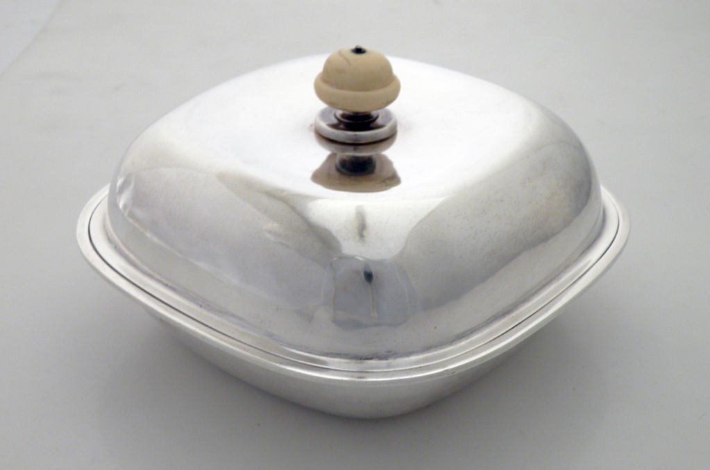 Being offered is a fine circa 1930 sterling silver entree dish with cover by Herbert A. Taylor for Arthur J. Stone, of Gardiner, MA, the arts and crafts dish and cover of simple design, with ivory knob-like finial.  Total weight shy of 20 ozs.  