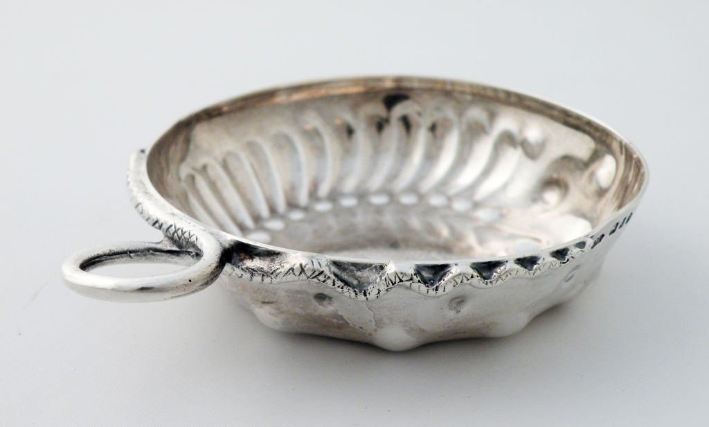 Being offered is a fine circa 1900 sterling silver wine taster  by an unknown maker, of London, England, the body chased with an applied snake-like serpent handled.   Marked as illustrated. No monogram.  Dimensions 4 inches over handle by 3 1/4
