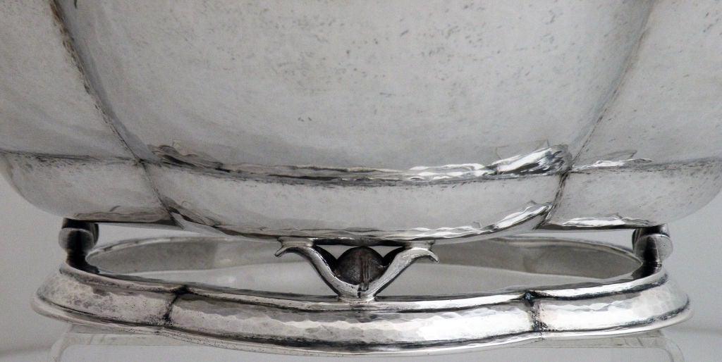 Being offered is a fine circa 1920 sterling silver bowl  by Randahl, of Chicago, IL, hand wrought, the four (4) lobed bowl with everted lip, resting on four (4) leaf-like forms, all resting on a raised pedestal base. Marked as illustrated. No