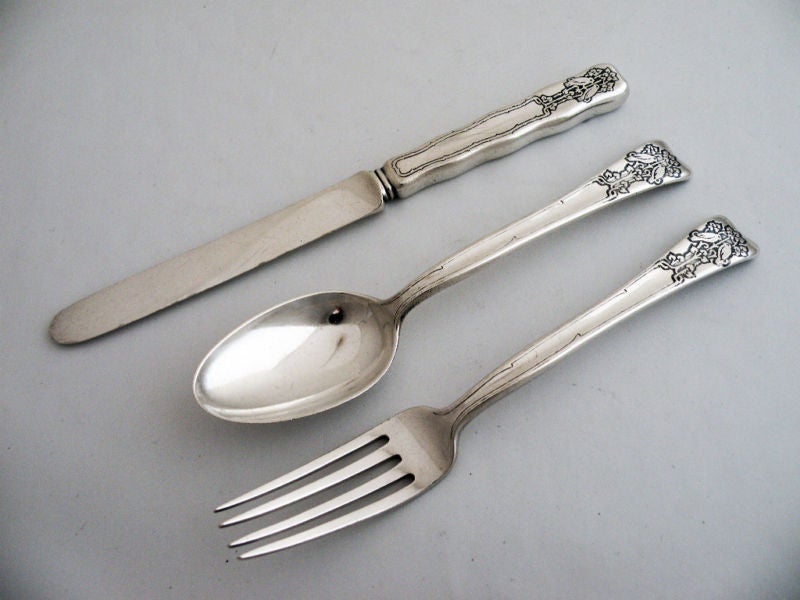 Being offered is a rare circa 1910 sterling silver three (3) piece child's flatware set by Tiffany, of New York, in the lap over pattern which was patented in 1880, each handle acid etched and engraved at top of handle with perched love birds,