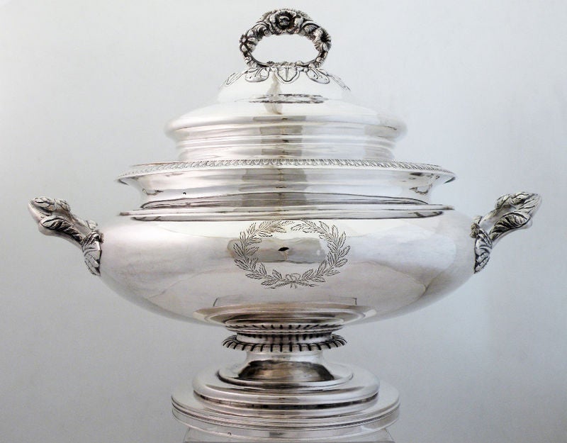 Being offered is a fine circa 1840 coin silver tureen with liner by J & I Cox, New York, handwrought, the lid with elaborate chasing and applied cast handle, the liner with handles, the tureen with superb applied cast handles, with an applied die