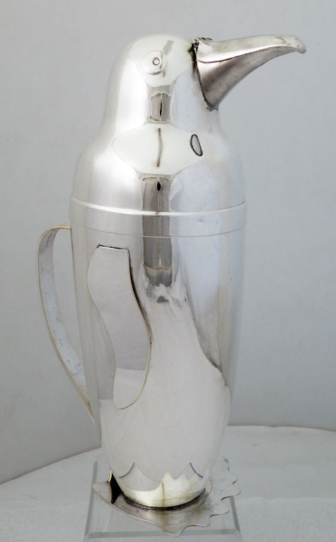 Being offered is a rare circa 1940 silverplate cocktail shaker - pitcher originally designed in 1936 by Emil A. Schuelke for Napier Co., of Meriden, CT., in the realistic form of a penguin, with applied fins, eyes, a 'beak' from where liquid is