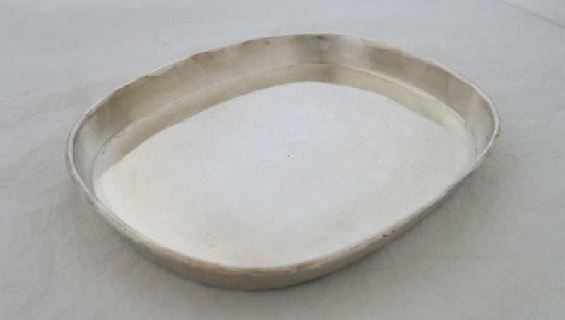 Being offered is a rare and useful circa 1955 sterling silver serving platter by William Spratling, of Taxco, Mexico, handwrought of simiple design. Dimensions 10 1./2 inches by 9 inches by 1 1/8 inches high. Weight shy of 31 ozs. No monogram. In