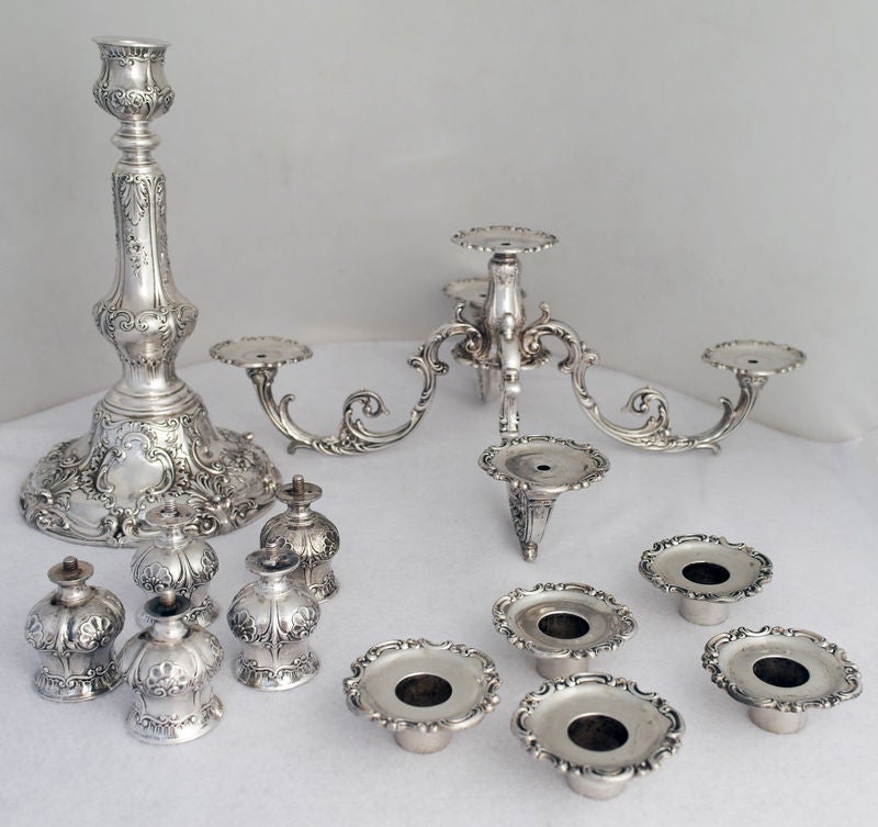 Being offered is a superb pair of circa 1907 sterling silver candelabra by Gorham, of Providence, RI, decorated with foliate scrolls and floral sprays, each with removeable candlearms.  Please note screw mechanism of candle holder into arm of