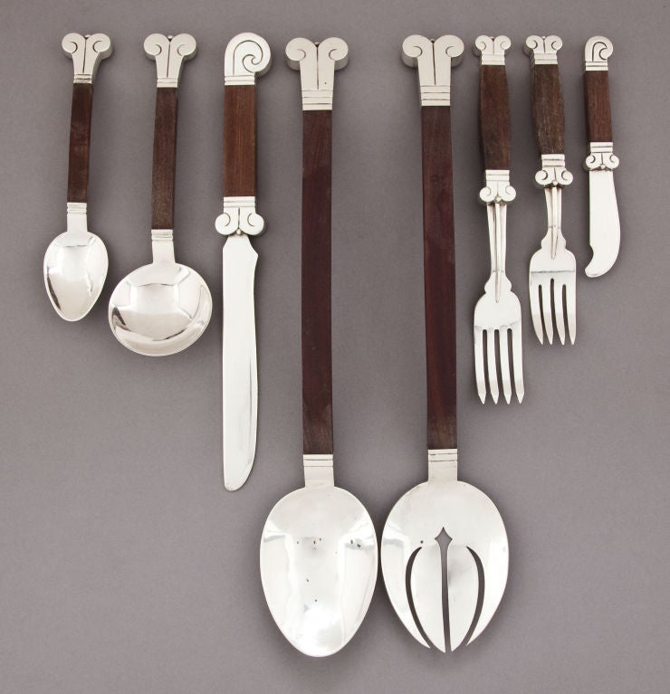Being offered is a rare circa 1950 sterling silver and rosewood flatware set by Hector Aguilar, of Taxco, Mexico, in the Aztec pattern, service for twelve with rosewood handles, silver applied at base and top of handle.  All marked.  In excellent