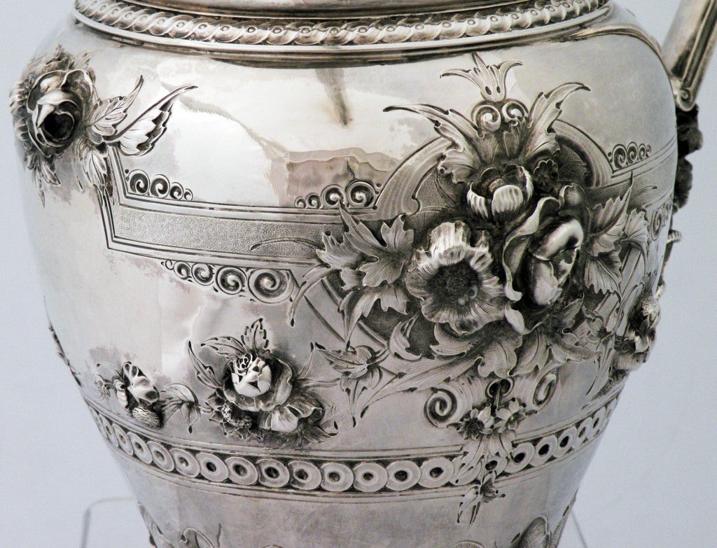 Being offered is perhaps the best coin silver circa 1865 pitcher by Gorham of New York seller has offered.  The foliate and floral chasing is of extraordinarly high relief; with chased leaves at bottom section of pitcher, the applied handle includes