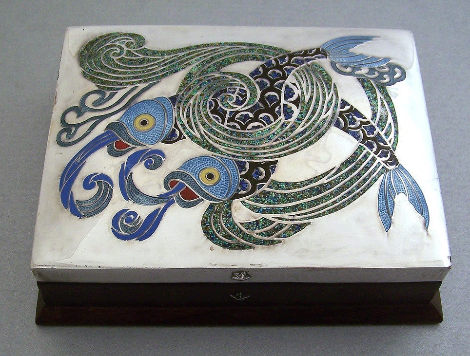 Being offered is an exceedingly rare and important circa 1953 sterling silver, multicolored enamel, wood and copper Leaping Fish box by Margot de Taxco 5561, (Margot Van Voorhies), of Taxco, Mexico, the motif being leaping koi fish in waves.  The