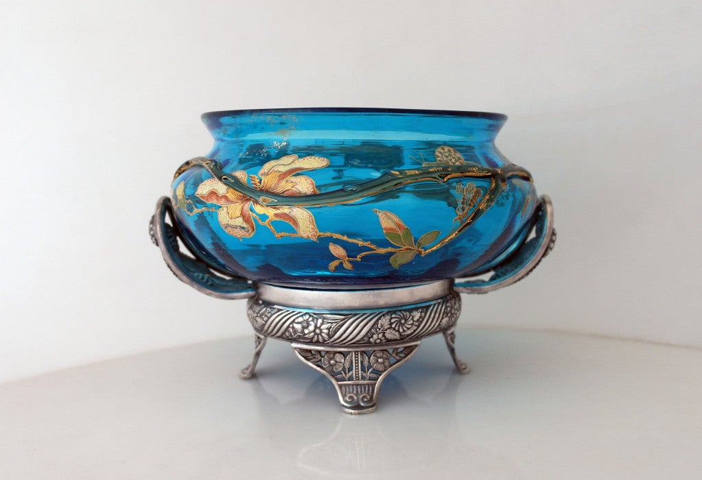 Being offered is a museum quality circa 1880 silverplate bride's basket by Pairpoint Manufacturing Company of New Bedford, MA, the original glass bowl with applied glass branch and hand painted with enameled floral accents and various insects