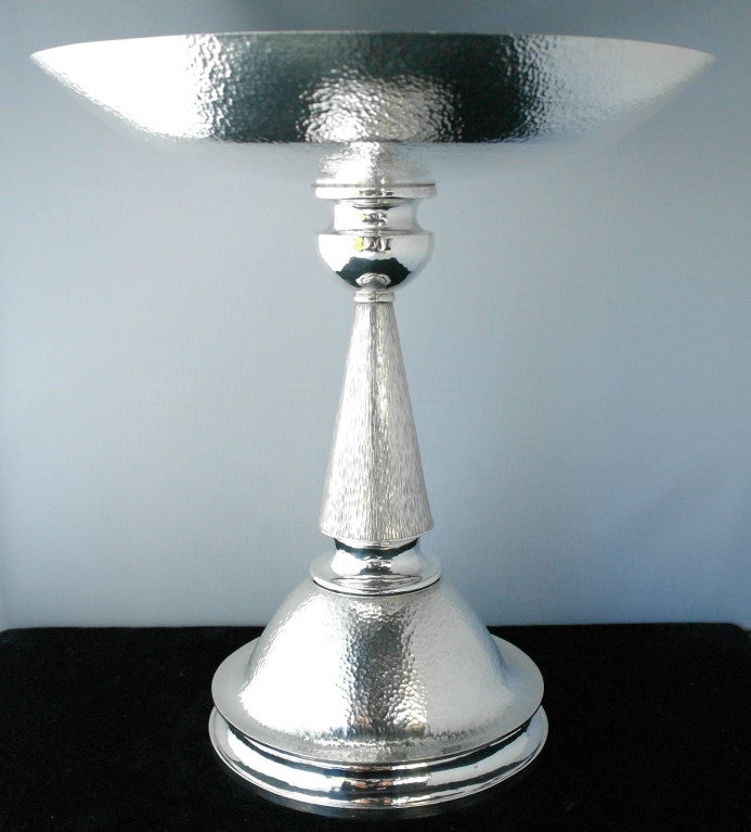 Being offered are a contemporary one-of-a-kind sterling silver tazza by award winning silversmith/artist, Haddon Hufford, of Frenchtown, Montana, masterfully handwrought and hand hammered, the elegant and varied pedestal hammered in different