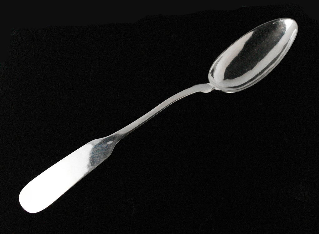 Being offered is a fine, circa 1940s sterling silver large serving, stuffing spoon by William Spratling of Taxco, Mexico, entirely hand-wrought, the handle in a fiddleback design. Weight shy of 5 oz. No monogram. Dimensions: 12 1/4 inches long.