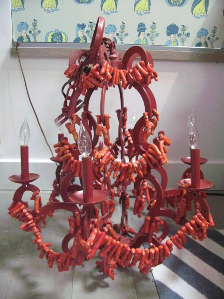 Wrought iron frame and chain dressed with fossilized red coral