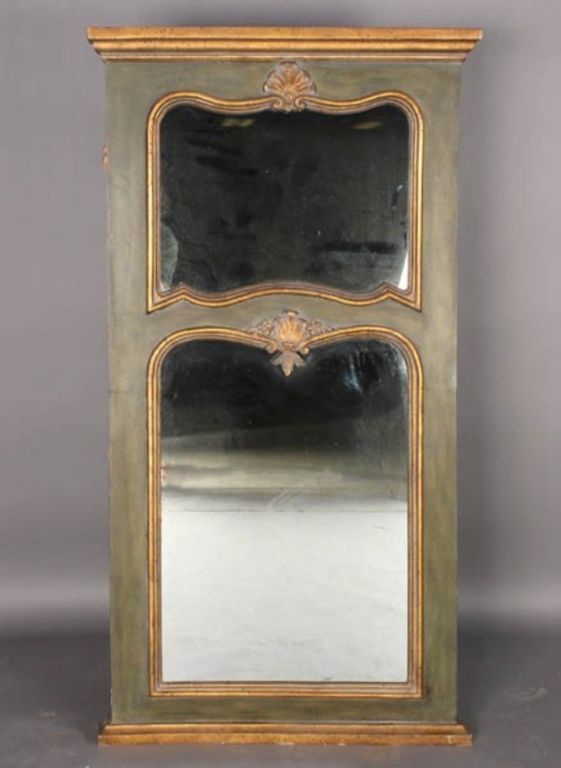 Two toned with carved embellishments at the top of each of the two mirrors