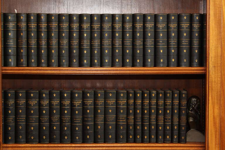 The complete writings of Dumas, 40 volumes.  Illustrated. Published  New York and Boston by E.B. Hall and Company.  Bound in  three quarter navy blue morocco, marbled boards, raised bands,  top edge gilt. A handsome set.