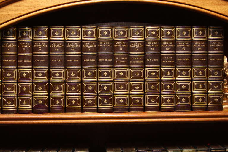 The complete works of Guy De Maupassant. 17 volumes.  Illustrated in color with a letter. Bound in three brown morocco,  raised bands, gilt title, top edge gilt. Published by Walter  Dunne and Company.