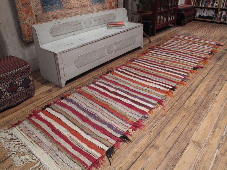 This type of Tulu rug, from Southeastern Turkey, rarely comes in this skinny format and the diagonal design is somewhat unusual too. It is a pretty nice one.