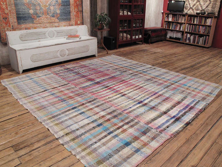 An old tribal flatweave, woven with an ingenious mixture of cotton rag and yarn, creating a sturdy fabric with an interesting texture. Consists of three panels woven on a narrow loom. Larger than usual, square-ish size. A very nice example of this