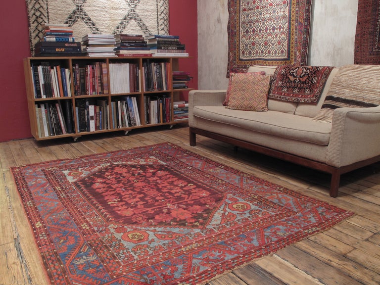 Decorated with stylized tulips, carnations and a profusion of other floral forms, Kula rugs like this represent a direct link with classical Ottoman art.